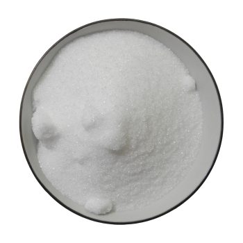 Refined white granulated sugar on a white background